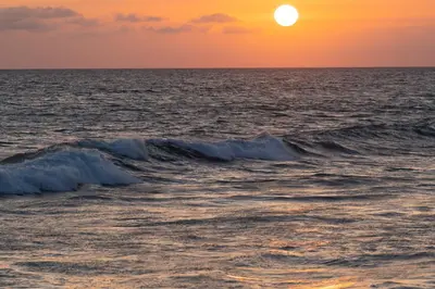 a sunset over the ocean with waves at 1317 S Pacific - Unit A in Oceanside