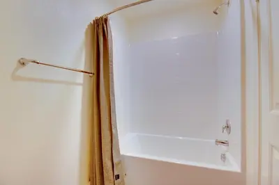 a shower with a glass door in a bathroom at Luxurious and Spacious Family Duplex in Menifee! in Menifee