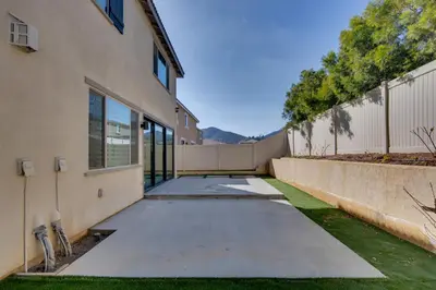 an empty sidewalk in front of a building at Luxurious and Spacious Family Duplex in Menifee! in Menifee