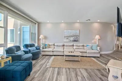 a living room with a couch and two chairs at 901 S Pacific in Oceanside
