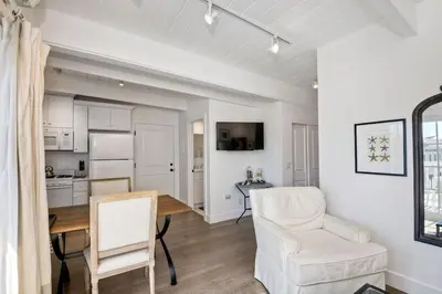 a kitchen and dining room with a table and chairs at 3690 Carlsbad Boulevard - Unit D in Carlsbad