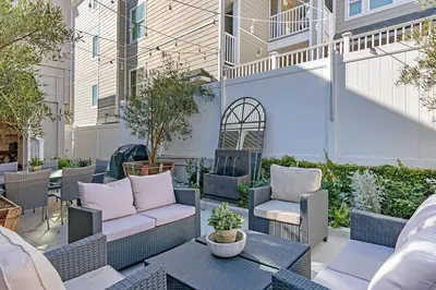 a patio with chairs and a couch and a table at 3690 Carlsbad Boulevard - Unit B in Carlsbad