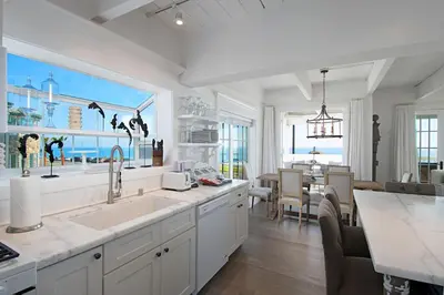 a kitchen with a sink and a dining room at 3690 Carlsbad Boulevard - Unit B in Carlsbad