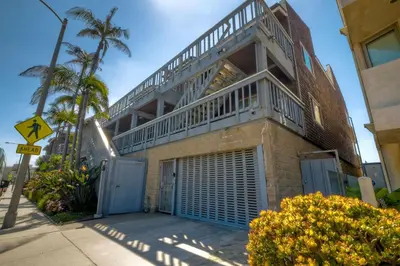 a building with a balcony on top of it at 1445 S Pacific Street Unit E in Oceanside