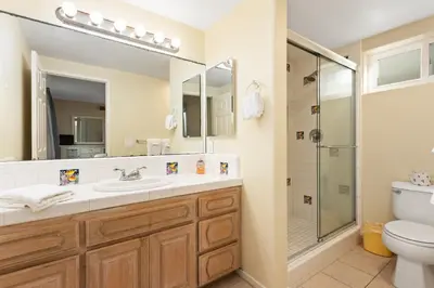 a bathroom with a sink and a shower at 1317 S Pacific - Unit C in Oceanside