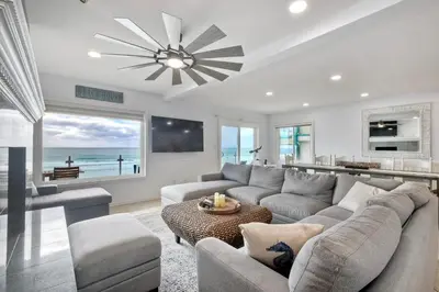 a living room with a couch and a table at 1409 S Pacific Street 5BR in Oceanside