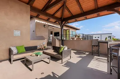 a patio with a couch and a table at 5194 Carlsbad - Upper in Carlsbad