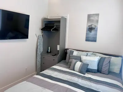 a bedroom with a bed and a television in it at 1128 Tait Street Unit D in Oceanside
