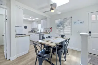 a kitchen and dining room with a table and chairs at 1128 Tait Street Unit D in Oceanside