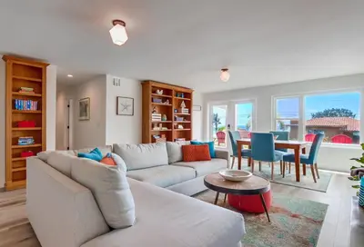 a living room with a couch and a table at Oceanview Suite Hilltop in San Diego