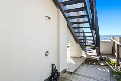 a stairway leading down to the beach from a house at 1317 S Pacific Unit B in Oceanside