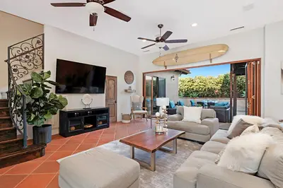 a living room with a couch and a tv at 5194 Carlsbad - Entire Home in Carlsbad
