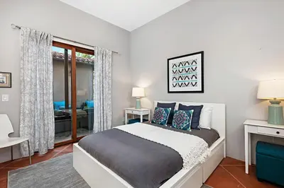 a bedroom with a large bed and a window at 5194 Carlsbad - Entire Home in Carlsbad
