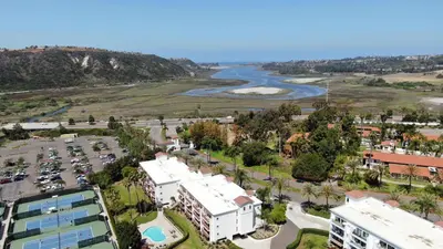 an aerial view of a city with a river and buildings at 2003 Costa Del Mar Road - Unit 678 in Carlsbad