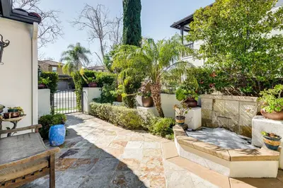 a patio with a bench and plants and a fence at 9 Mi to Beach Pet-Friendly Apt in San Diego! in San Diego