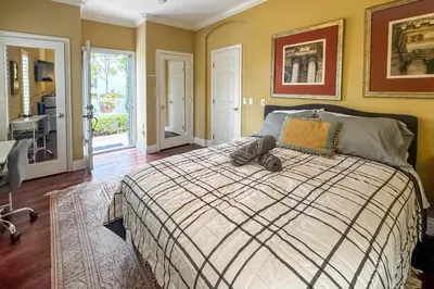 a bedroom with a bed with a comforter at 9 Mi to Beach Pet-Friendly Apt in San Diego! in San Diego
