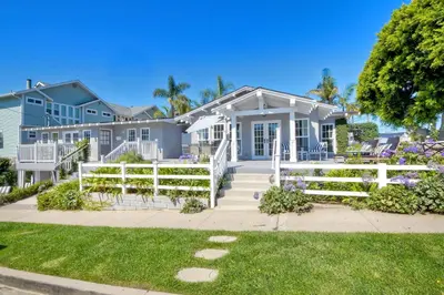 a house with a white fence in front of it at 180 n 190 Walnut Entire Home in Carlsbad