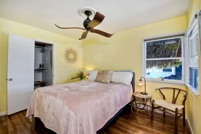 a bedroom with a bed and a ceiling fan at 167 Tamarack in Carlsbad