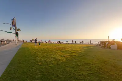 a person walking on a beach with the ocean in the background at 167 Tamarack in Carlsbad