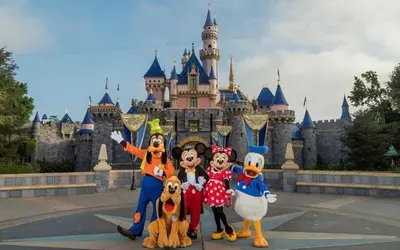 a group of people posing in front of a castle at 180 Walnut Upper in Carlsbad