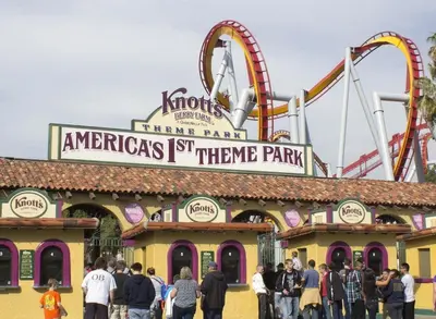 a group of people standing in front of a theme park at 180 Walnut Upper in Carlsbad