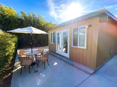a small cabin with a table and chairs and an umbrella at Hideaway in the heart of San Diego in San Diego