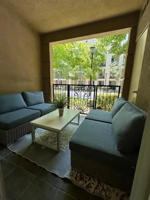 a living room with a couch and a table at Irvine Gem Luxury condo 31 days min near Irvine Business & UCI Hospital in Irvine