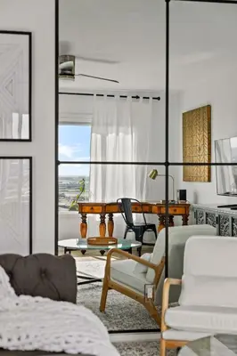 a living room with a table and chairs at Majestic Mermaid Retreat in San Diego