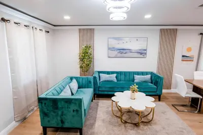 a living room with a couch and a table at Exotic home Cumberland street by sdstay in San Diego