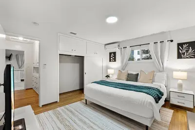 a white bedroom with a bed and a window at Entire Private Home with 4 Bedrooms 2 Bathrooms, Spacious, Lux King Bed, Ranch Style, Prime Area, Available Now in La Mesa