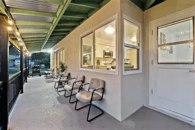 a row of chairs sitting on a porch at Entire Private Home with 4 Bedrooms 2 Bathrooms, Spacious, Lux King Bed, Ranch Style, Prime Area, Available Now in La Mesa