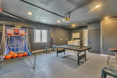 a ping pong room with a ping pong table at Tropical Bliss - 5BR Pool Spa Games 12 min to dwtn in San Diego