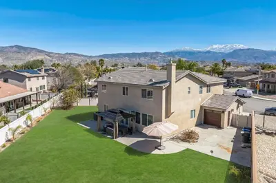 an aerial view of a house with a lawn at Carroll Family Retreat in San Jacinto