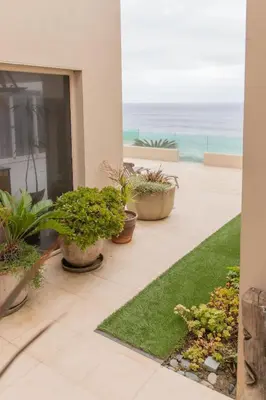 a patio with plants and a view of the ocean at La Jolla Suite with Ocean View Patio in San Diego