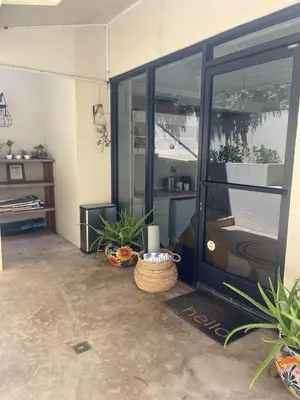 a room with a glass door with plants in it at La Jolla Suite with Ocean View Patio in San Diego
