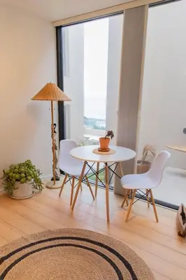 a table and chairs in a room with a window at La Jolla Suite & Beach Access in San Diego
