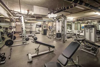 a gym with a lot of exercise equipment in it at Gaslamp 2 bed Penthouse Petco Park Convention Ctr in San Diego