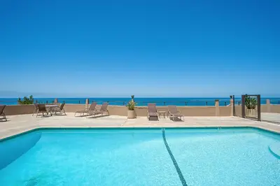 a swimming pool with the ocean in the background at Coastal Heights - DMBC857C in Solana Beach
