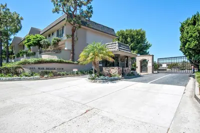 a house with a sign that reads our next end at Coastal Heights - DMBC857C in Solana Beach