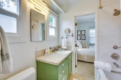 a bathroom with a sink and a tub and a shower at Walkable Cottage Near Balboa Park with Yard and Grill! in San Diego