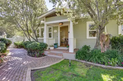 a house with a brick walkway leading to the front door at Walkable Cottage Near Balboa Park with Yard and Grill! in San Diego