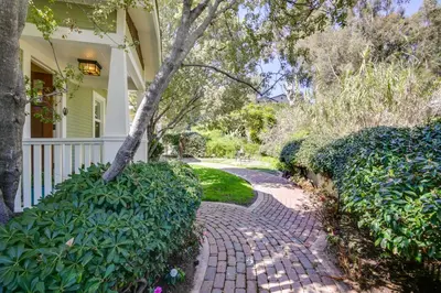 a brick walkway in front of a house at Walkable Cottage Near Balboa Park with Yard and Grill! in San Diego