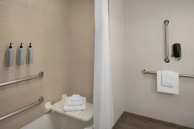 a bathroom with a tub and a toilet and a shower at Courtyard by Marriott San Diego Gaslamp/Convention Center in San Diego