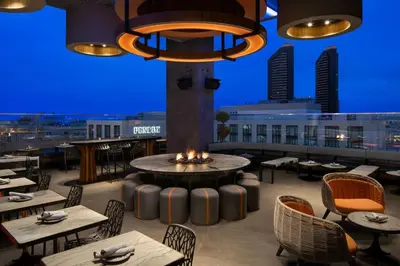 a restaurant with a fountain and tables and chairs at Courtyard by Marriott San Diego Gaslamp/Convention Center in San Diego
