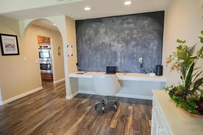 a classroom with a desk and a chalkboard on the wall at Wine Country Villa in Temecula