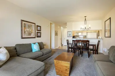 a living room with a couch and a table at Oceanside Beach Condos in Oceanside