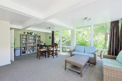 a living room with a blue couch and a table at Oceanside Beach Condos in Oceanside