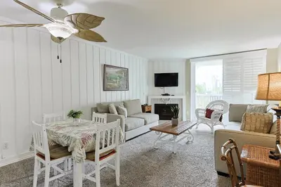 a living room with a couch and a table at Oceanside Beach Condos in Oceanside
