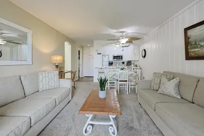 a living room with a couch and a table at Oceanside Beach Condos in Oceanside