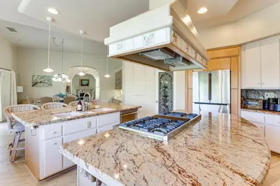 a large kitchen with a counter top and a island at 3 Mi to Beach Central and Elegant Home in Oceanside in Oceanside